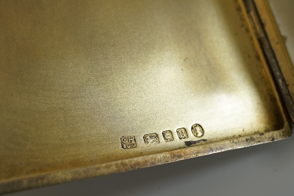 An engine turned silver rectangular cigarette box, 14.1cm and two mid 20th century engine turned silver cigarette cases.